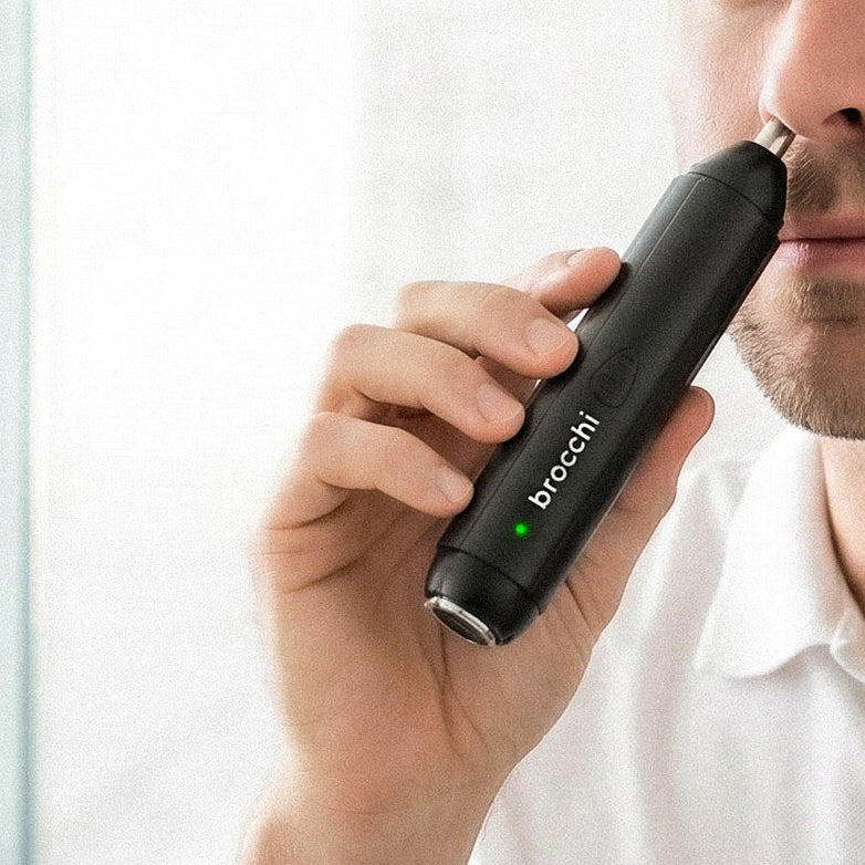 Using the nose trimmer end of the 2IN1 trimmer