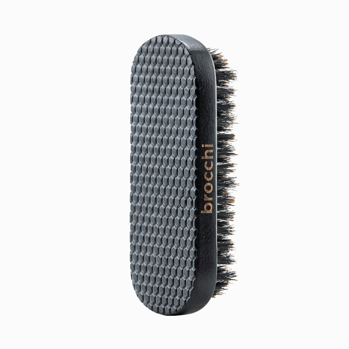 Textured wooden back of the Boar Bristle Grooming Beard Brush