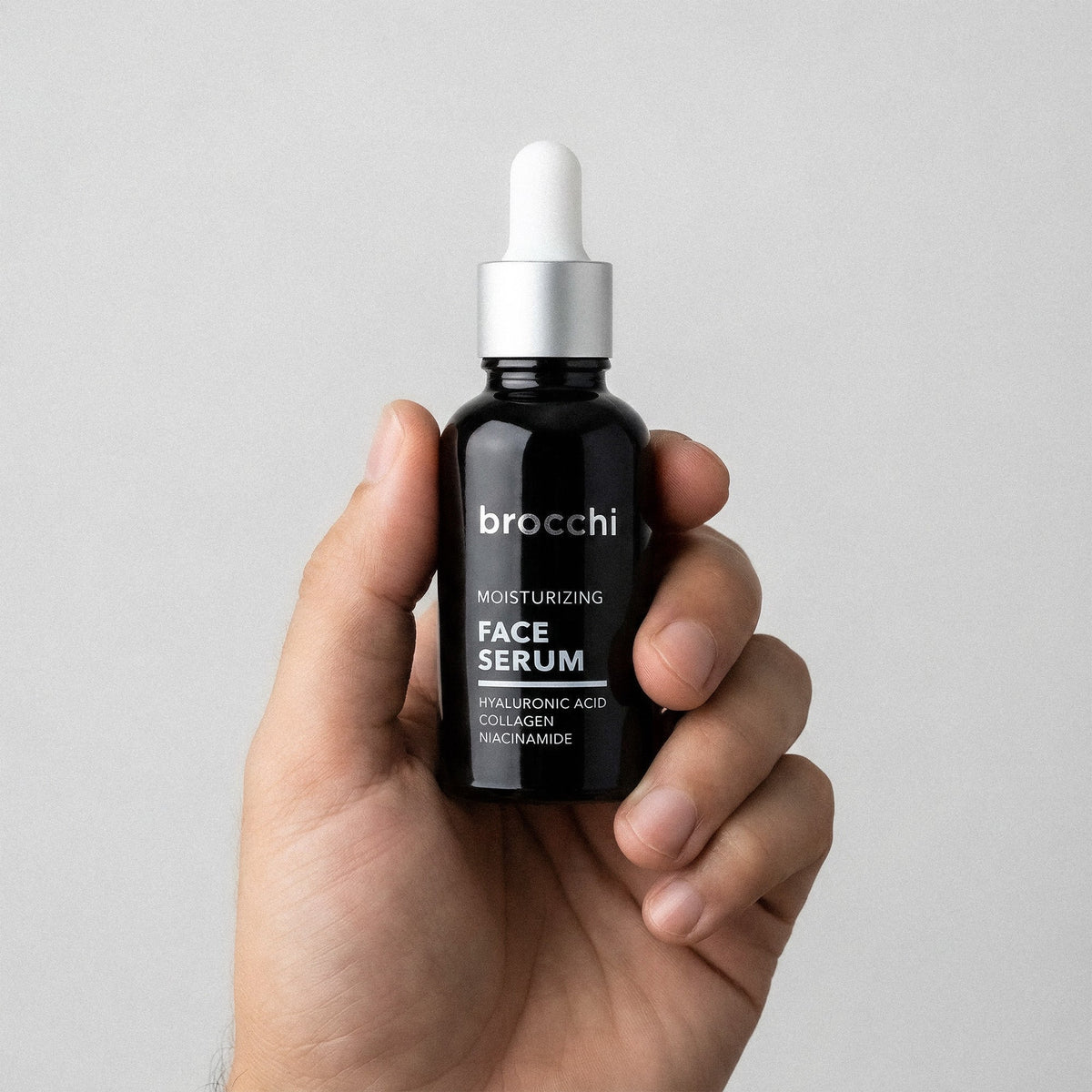 Hyaluronic Acid Face Serum bottle held in hand