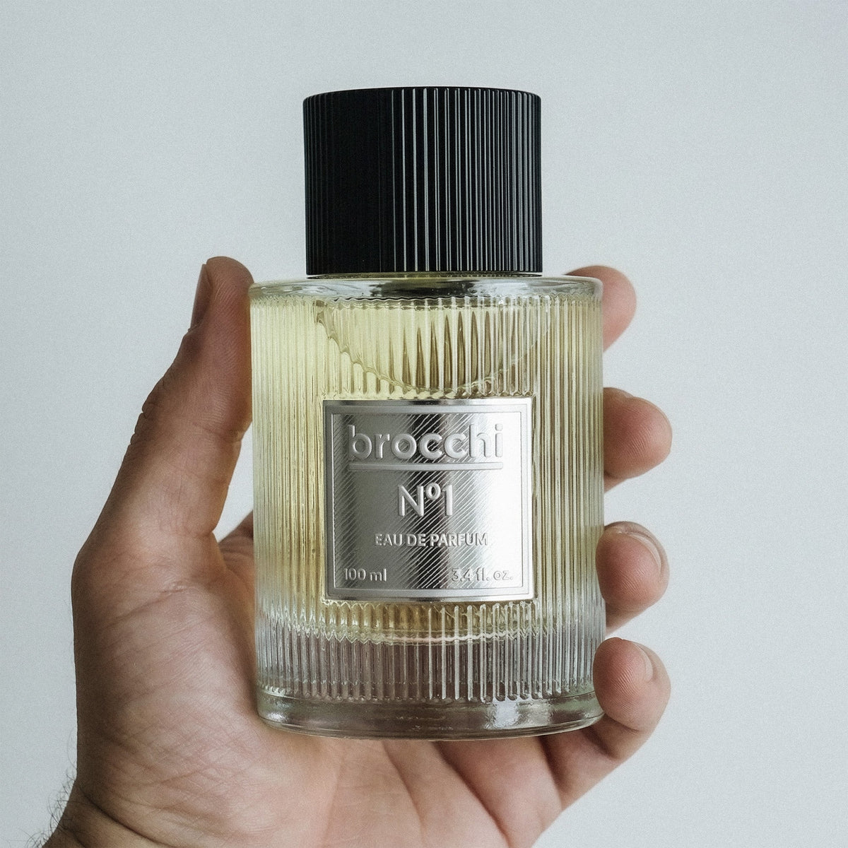Nº1 Eau de Parfum bottle held in hand