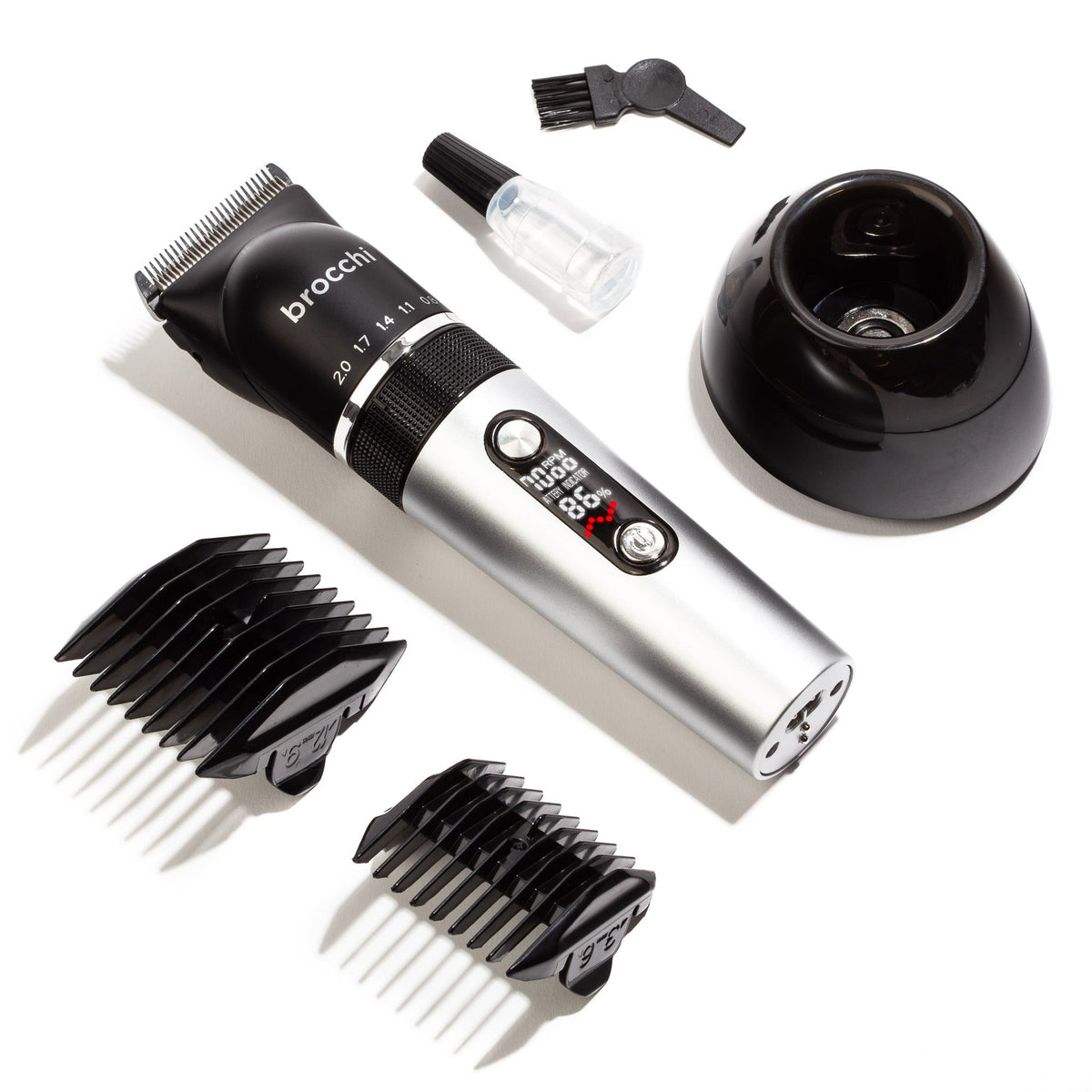 Clipper Pro with guide combs, charging base, cleaning brush and blade oil