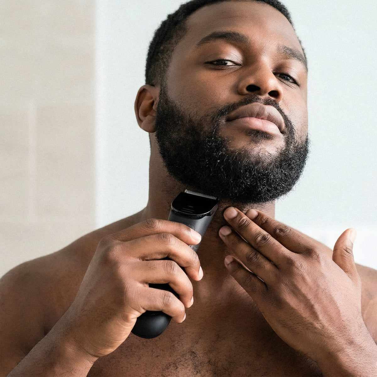 Trimming the beard line along the neck with the Precision Edge trimmer